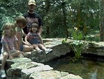 the girls and daddy by the water