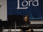 Jewell Plank plays the piano for the service.
